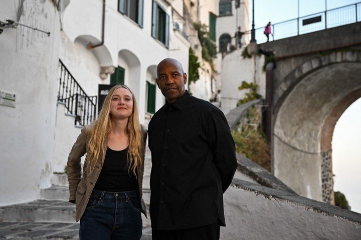 Dakota Fanning y Denzel Washington, en el set de "The Equalizer 3", que Campanella vio, no una, sino dos veces en el cine. AFP 